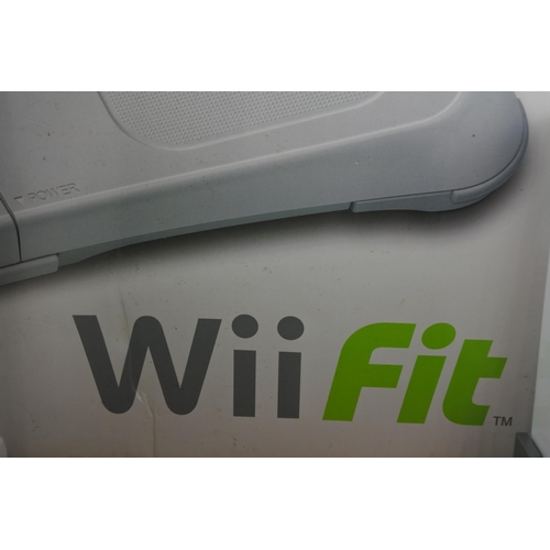 74 - A Nintendo Wii console, games, controllers and more.