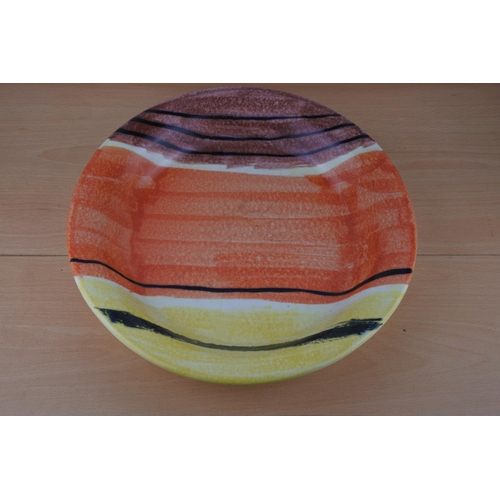 76 - A large Habitat platter. Approx 37cm.