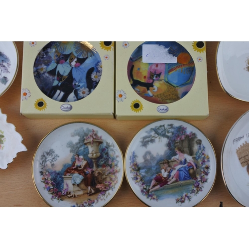 84 - A collection of small plates to include Hammersley, two boxed Goebel plates and more.