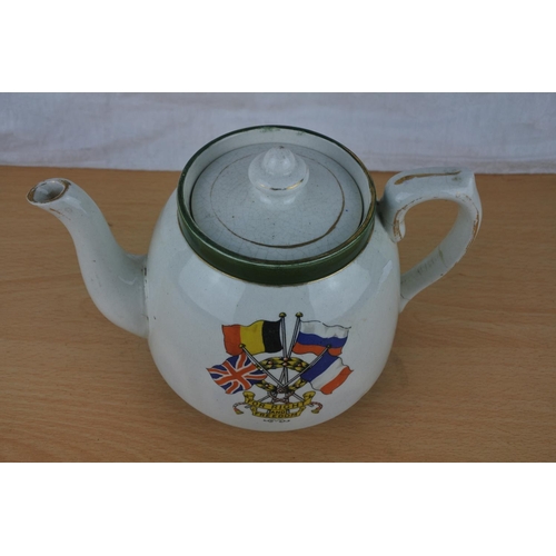 88 - An antique teapot 'For Right and Freedom', repairs to handle.