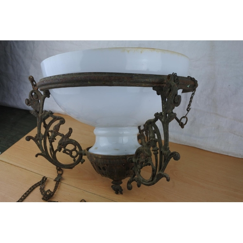 99 - An antique light fitting with milk glass shade.