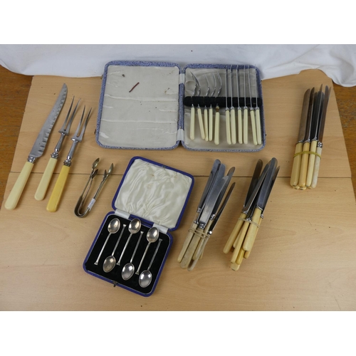 104 - Two boxed vintage cutlery sets and an assorted lot of vintage cutlery, carving set and more.