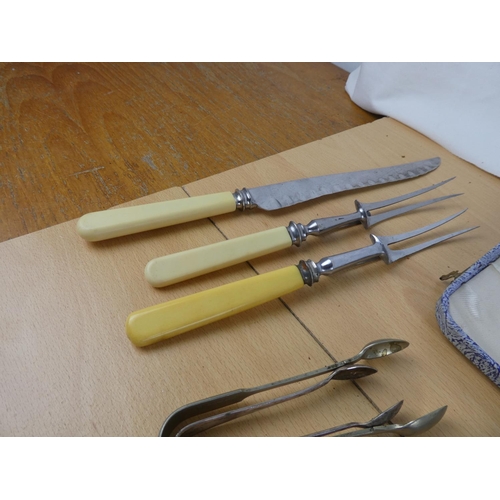 104 - Two boxed vintage cutlery sets and an assorted lot of vintage cutlery, carving set and more.