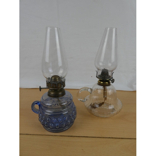 105 - A vintage blue glass and a clear glass finger lamp.