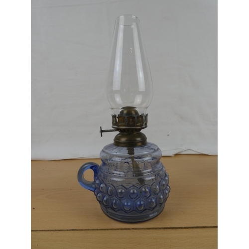 105 - A vintage blue glass and a clear glass finger lamp.