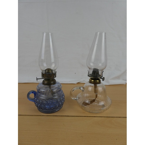 105 - A vintage blue glass and a clear glass finger lamp.