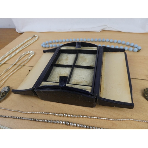 110 - A collection of vintage pearls and necklaces in an antique jewellery box.