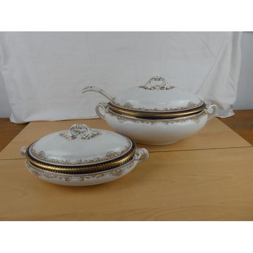 115 - Two antique Booth pottery lidded tureens and ladle.