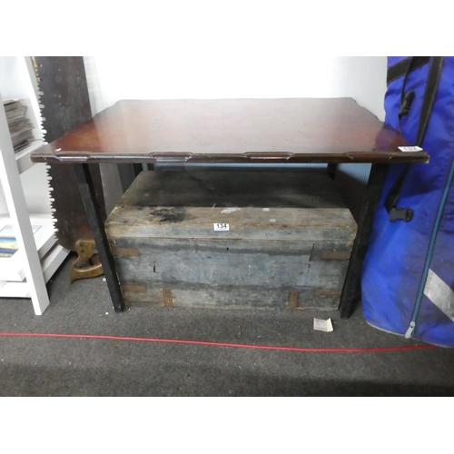 132 - A coffee table on a metal stand. Approx 53x79x55cm.