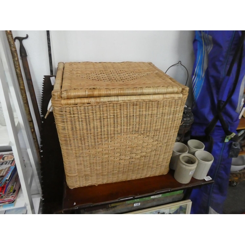 136 - A large wicker storage basket. Approx 52x52x41cm.