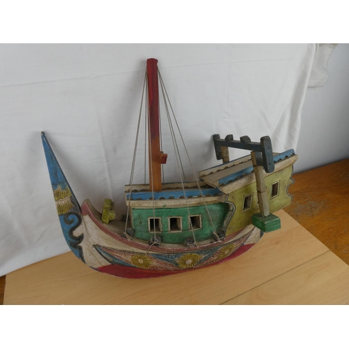 139 - A stunning wooden hand painted Oriental style fishing boat.