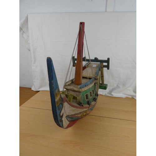 139 - A stunning wooden hand painted Oriental style fishing boat.