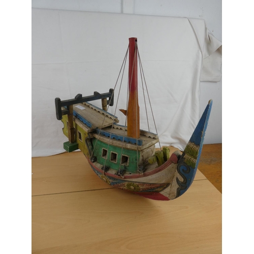 139 - A stunning wooden hand painted Oriental style fishing boat.