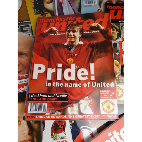 148 - A large lot of Manchester United official magazines.