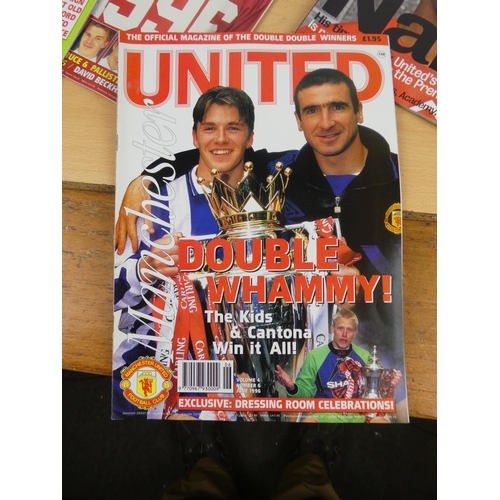 148 - A large lot of Manchester United official magazines.