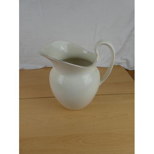 162 - An antique water jug. Approx 29cm.