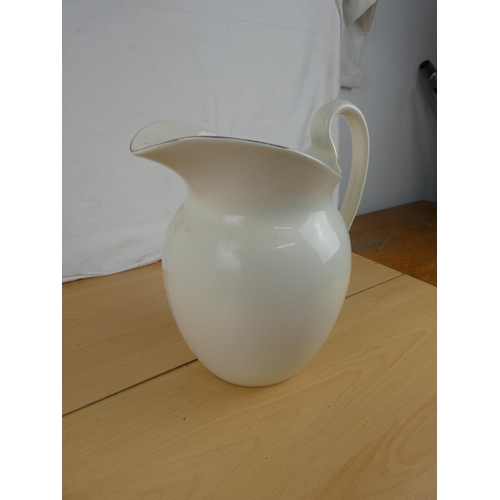 162 - An antique water jug. Approx 29cm.