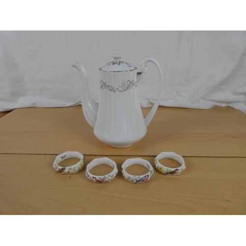 168 - A Paragon china teapot and a set of four bone china napkin rings,