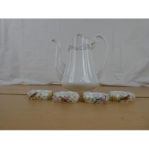 168 - A Paragon china teapot and a set of four bone china napkin rings,