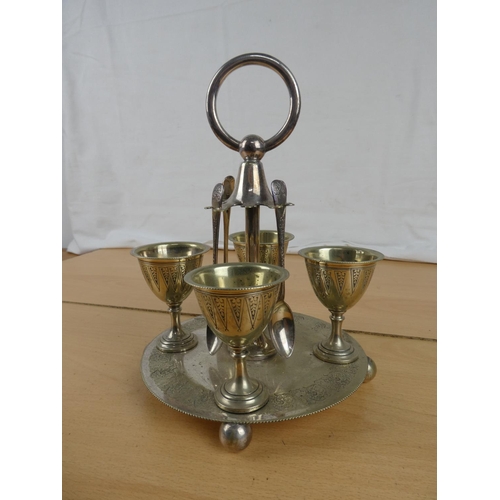 171 - A silver plated egg cup and spoon set,