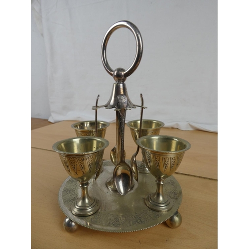 171 - A silver plated egg cup and spoon set,