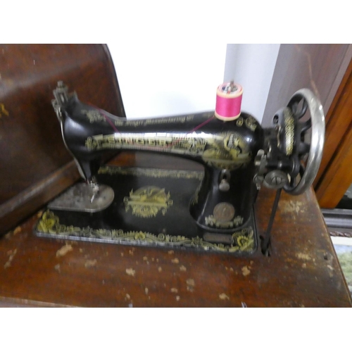 190 - An antique Singer sewing machine on original cast iron base. Approx - Base - 74x76xcm. Machine - 28x... 