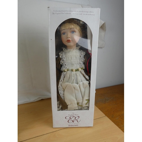 191 - Two boxed porcelain dolls.