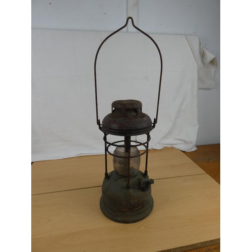 193 - An antique tilley oil lamp. Approx 34cm.