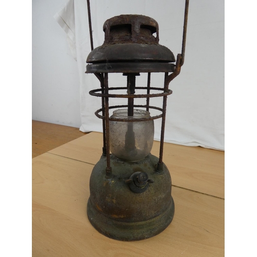 193 - An antique tilley oil lamp. Approx 34cm.