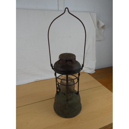 193 - An antique tilley oil lamp. Approx 34cm.