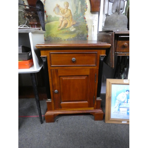 195 - A mahogany cabinet with pillar sides. Approx 66x50x40cm.