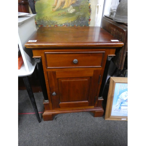 195 - A mahogany cabinet with pillar sides. Approx 66x50x40cm.