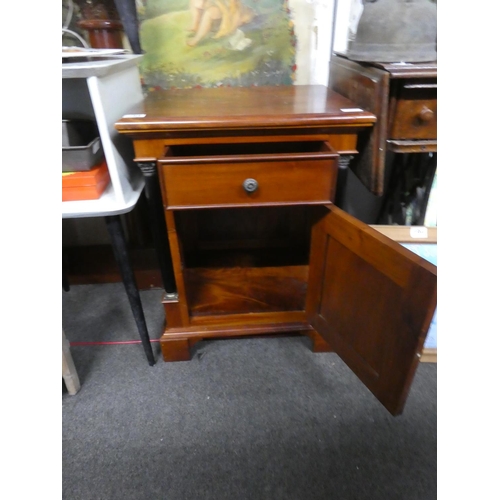 195 - A mahogany cabinet with pillar sides. Approx 66x50x40cm.