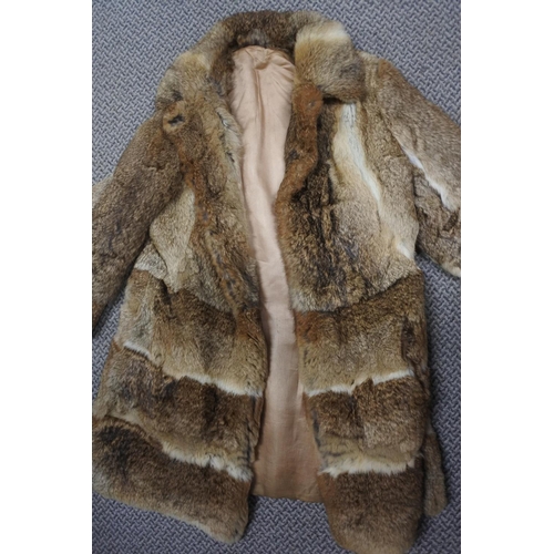 219 - A vintage fur coat.