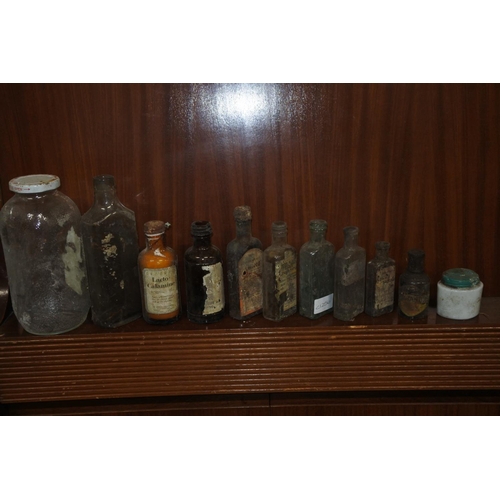 223 - A lot of vintage glass and ceramic bottles.