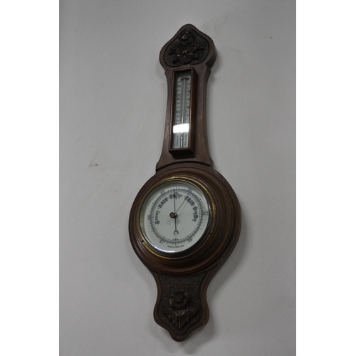 230 - An antique mahogany barometer with porcelain dial.