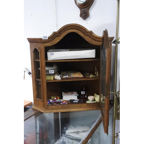 232 - A small oak wall hanging corner cabinet. Approx 69x70x46cm.