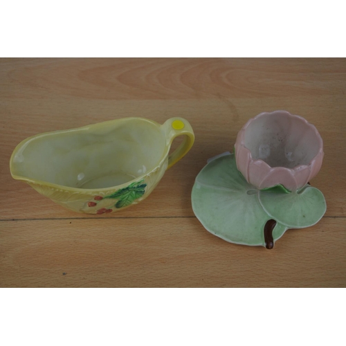 237 - A Carlton Ware hand painted lily pad small vase and sauceboat.