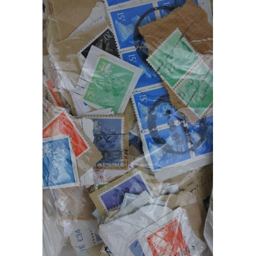 242 - A lot of mostly GB stamps on paper weighing 350grams.