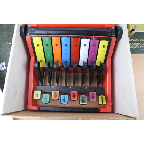 251 - A vintage boxed 'Type a Tune Typewriter' by Child Guidance Toys.