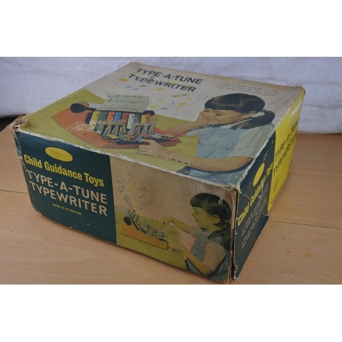 251 - A vintage boxed 'Type a Tune Typewriter' by Child Guidance Toys.