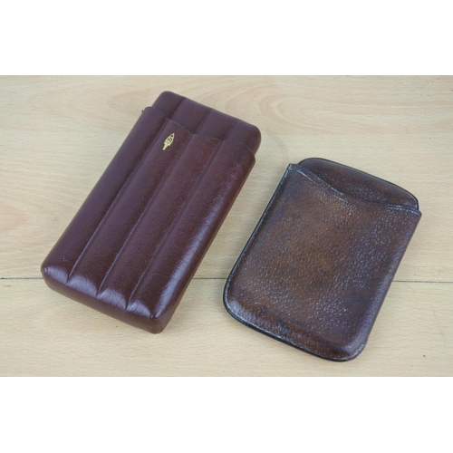 262 - A stunning vintage leather cigar case and another.