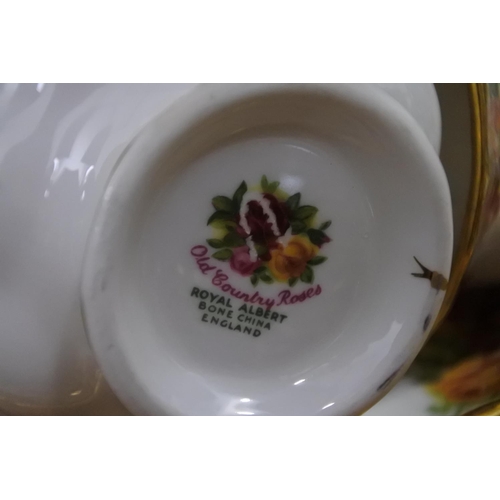 263 - A large collection of Royal Albert 'Old Country Rose' to include teapot, dinner plates, pudding bows... 