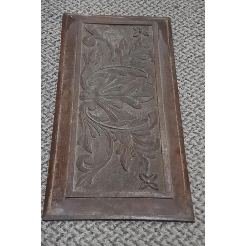 264 - A carved mahogany wooden panel. Approx 46x21cm.