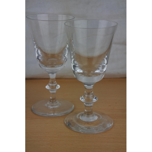 268 - A vintage glass water jug and three glasses.