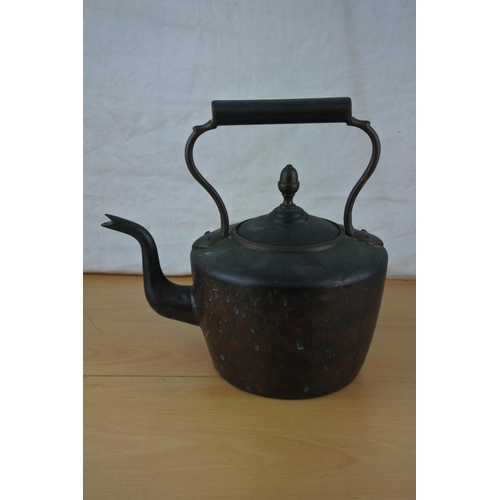 272 - An antique copper kettle.