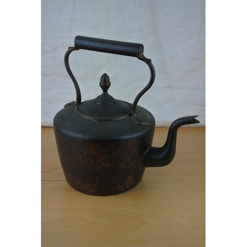 272 - An antique copper kettle.