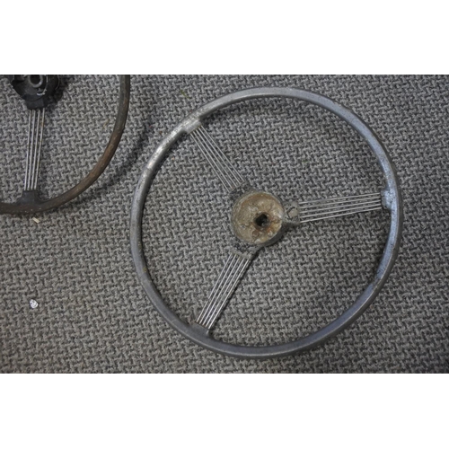 284 - Two early Morris Minor banjo steering wheels. Approx 40cm.