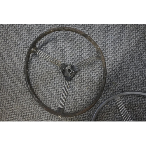 284 - Two early Morris Minor banjo steering wheels. Approx 40cm.