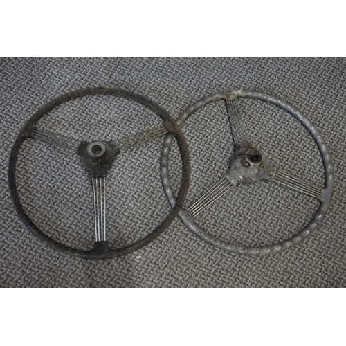 284 - Two early Morris Minor banjo steering wheels. Approx 40cm.